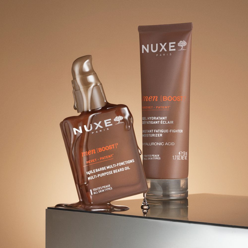 Zwei Produkte: Flasche mit Pumpe und Tube. Aufschrift: NUXE, men [BOOST]. Multi-Purpose Beard Oil und Feuchtigkeitscreme.