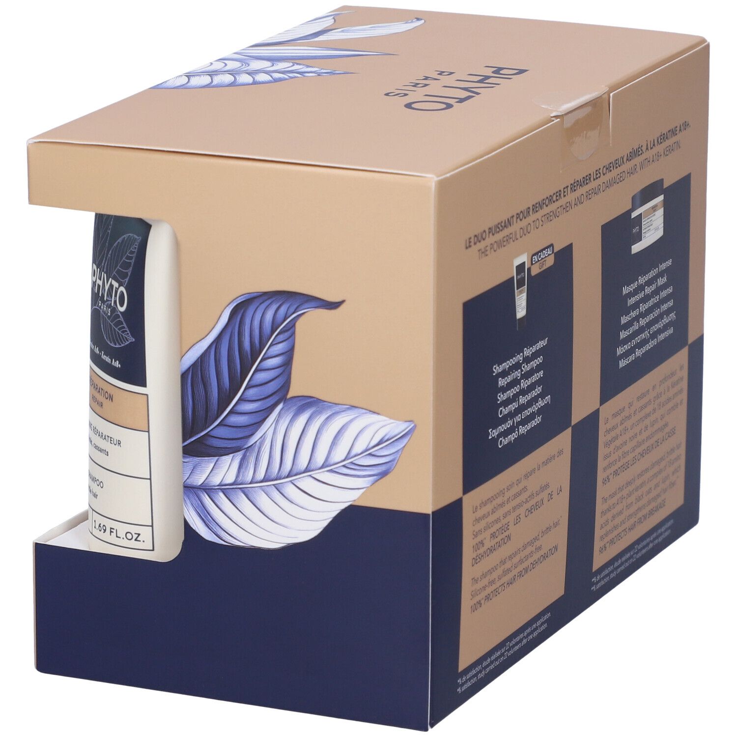 Geschenkbox mit Shampoo und Haarmaske. Karton mit blauem Blattmuster und Markenlogo. Enthält zwei Produkte.
