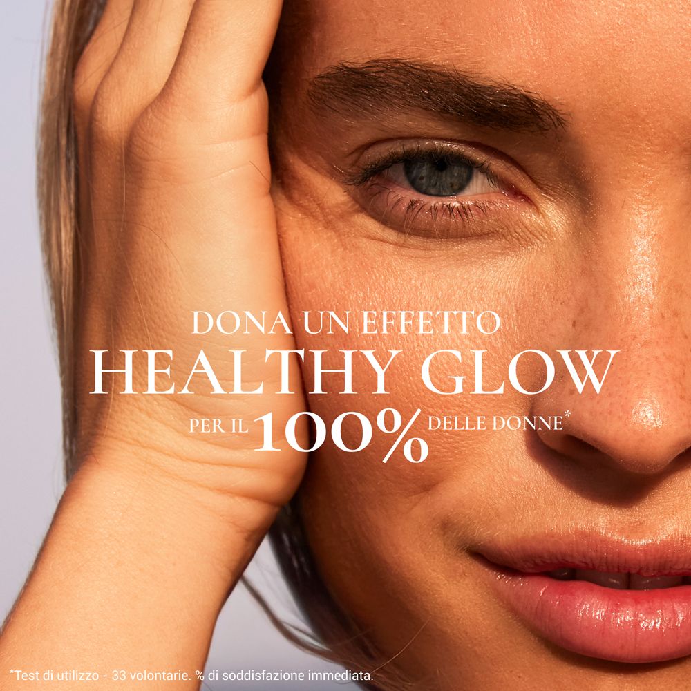 Primo piano di un viso. Testo: Healthy Glow per il 100% delle donne.