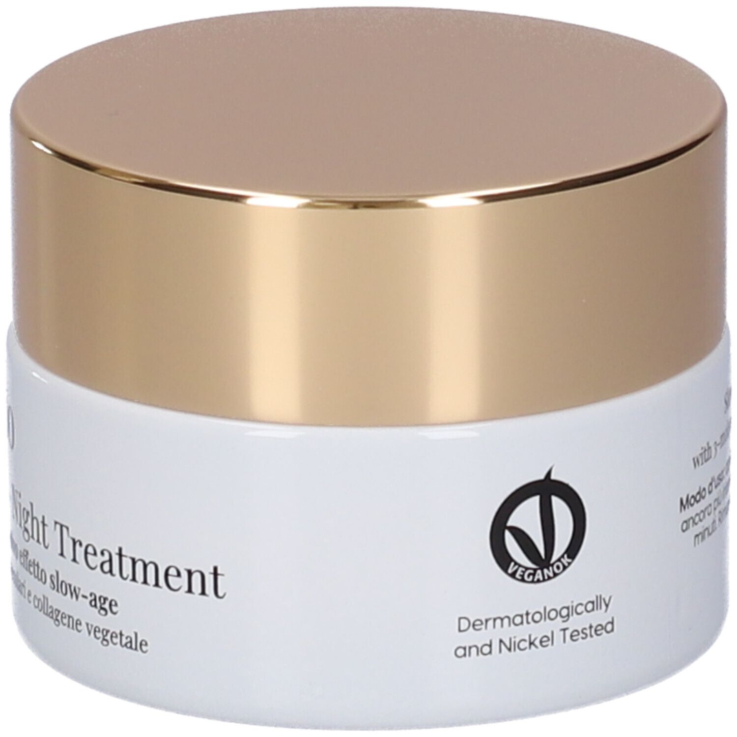 Vaso di crema con coperchio dorato. Scritta: Slow-aging intensive night treatment. Dermatologicamente testato.