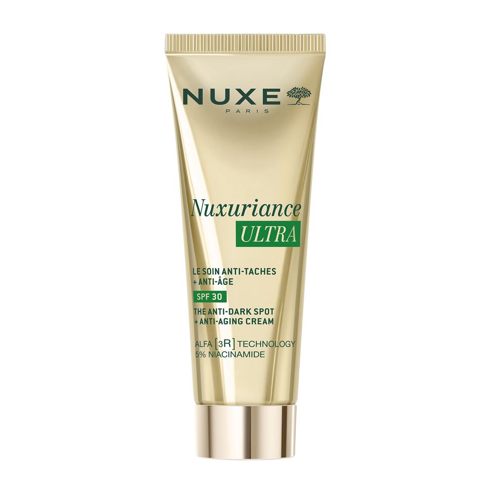 Tubo dorato Nuxe. Crema anti-macchie e anti-età SPF30. Scritta Nuxuriance Ultra. Contiene niacinamide.