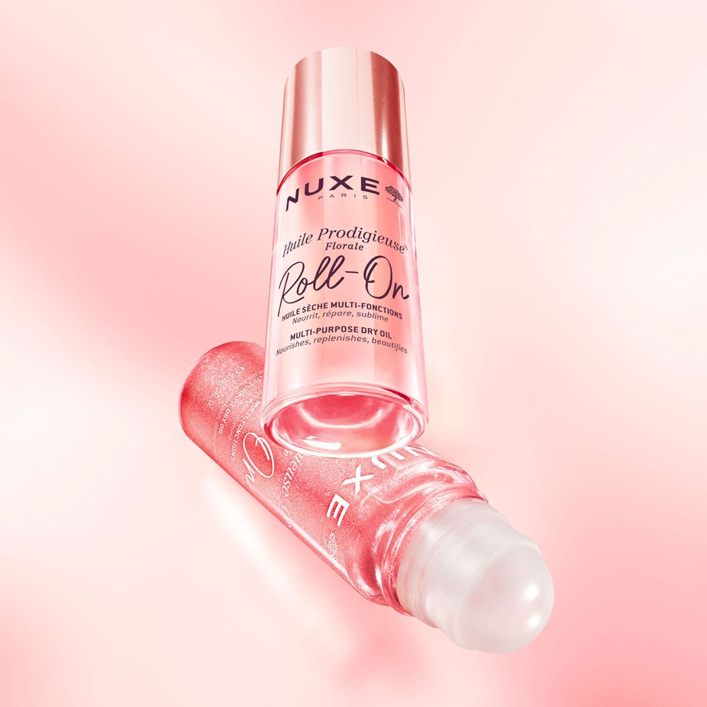 Due Nuxe Huile Prodigieuse Or Florale Roll-On. Rosa e dorato. Testo.