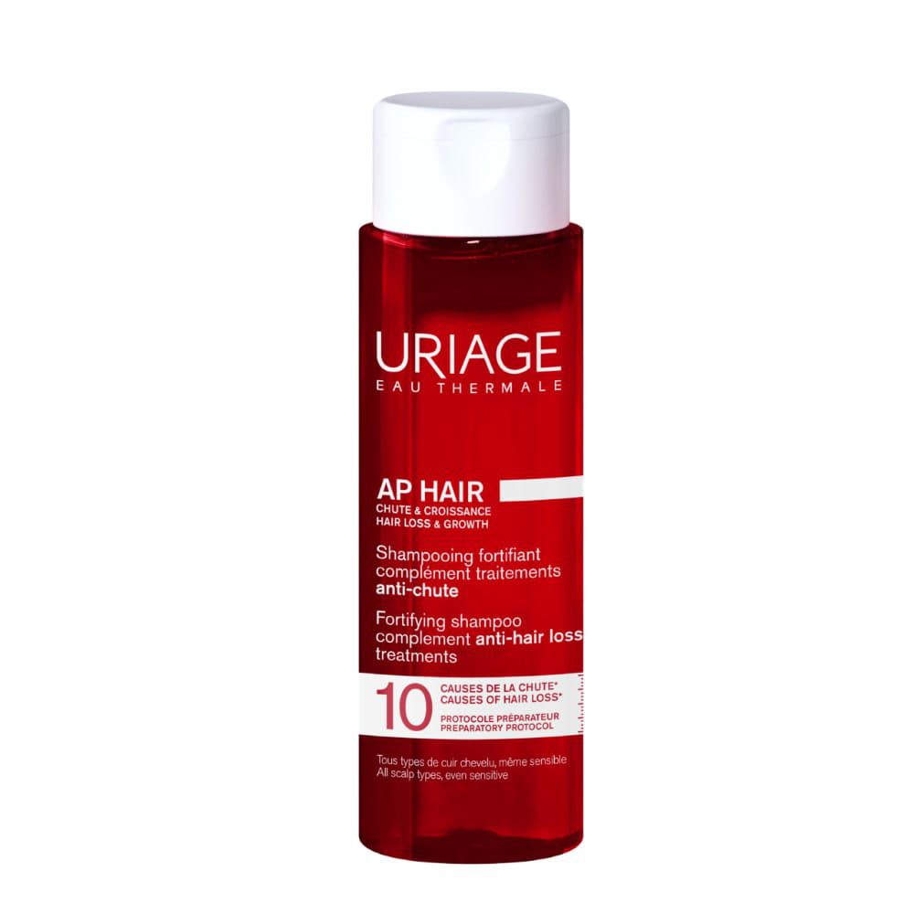 Rote Flasche Uriage AP Hair Shampoo gegen Haarausfall und für Haarwachstum.