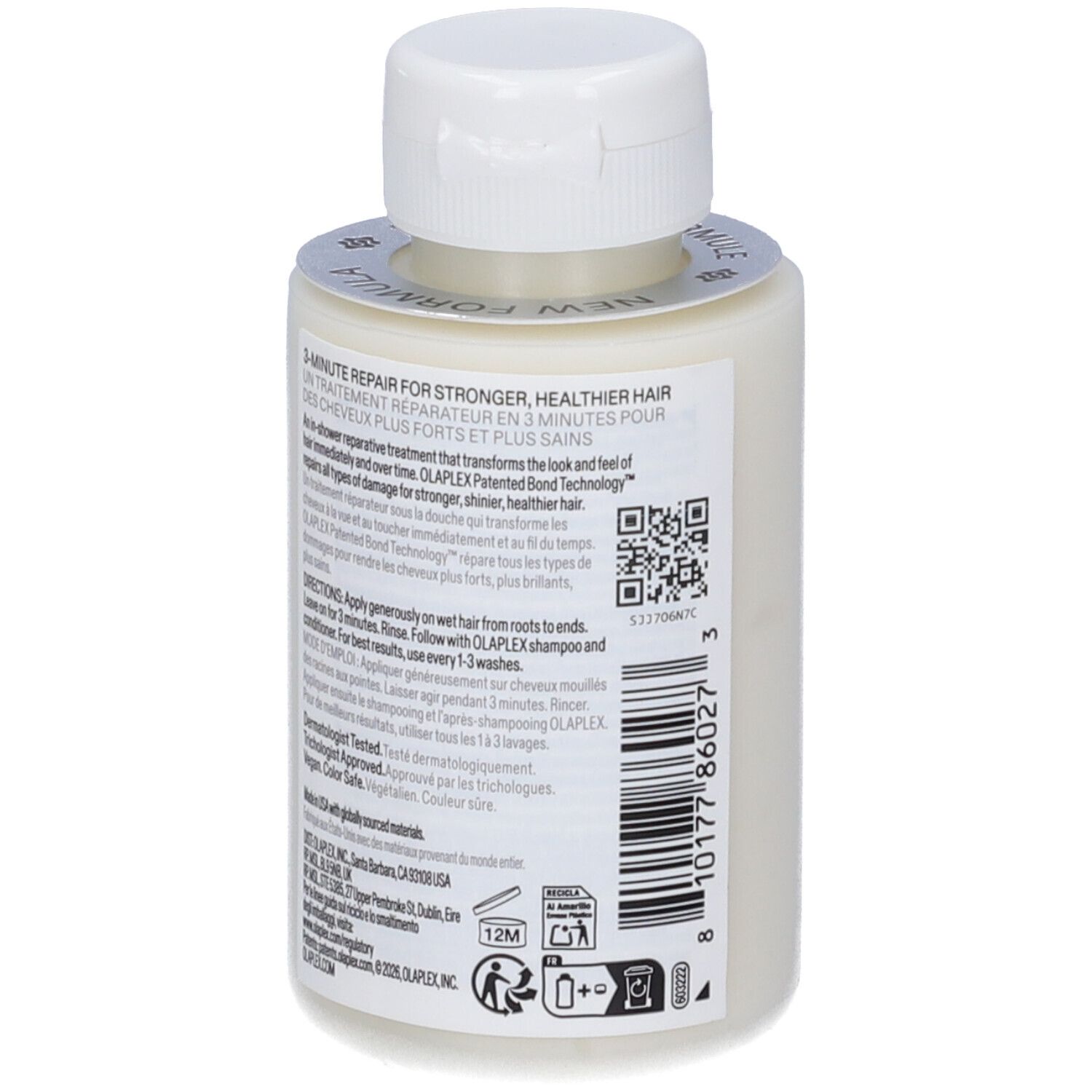 Kleine weiße Flasche mit weißem Verschluss und silbernem Siegel. Enthält Haarbehandlung.