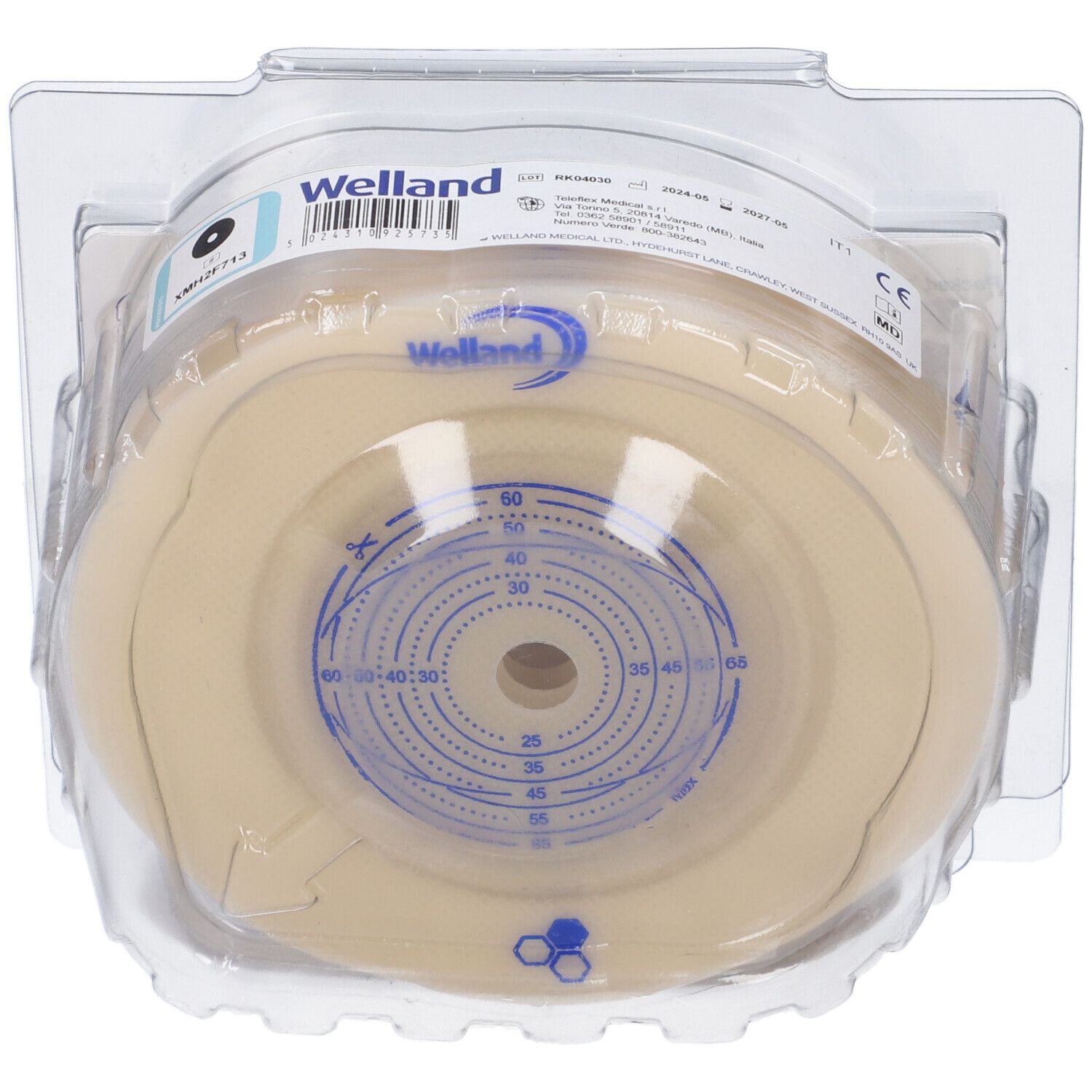 Prodotto Welland confezionato. Base beige rotonda con segni blu. Indicazioni di dimensioni visibili.