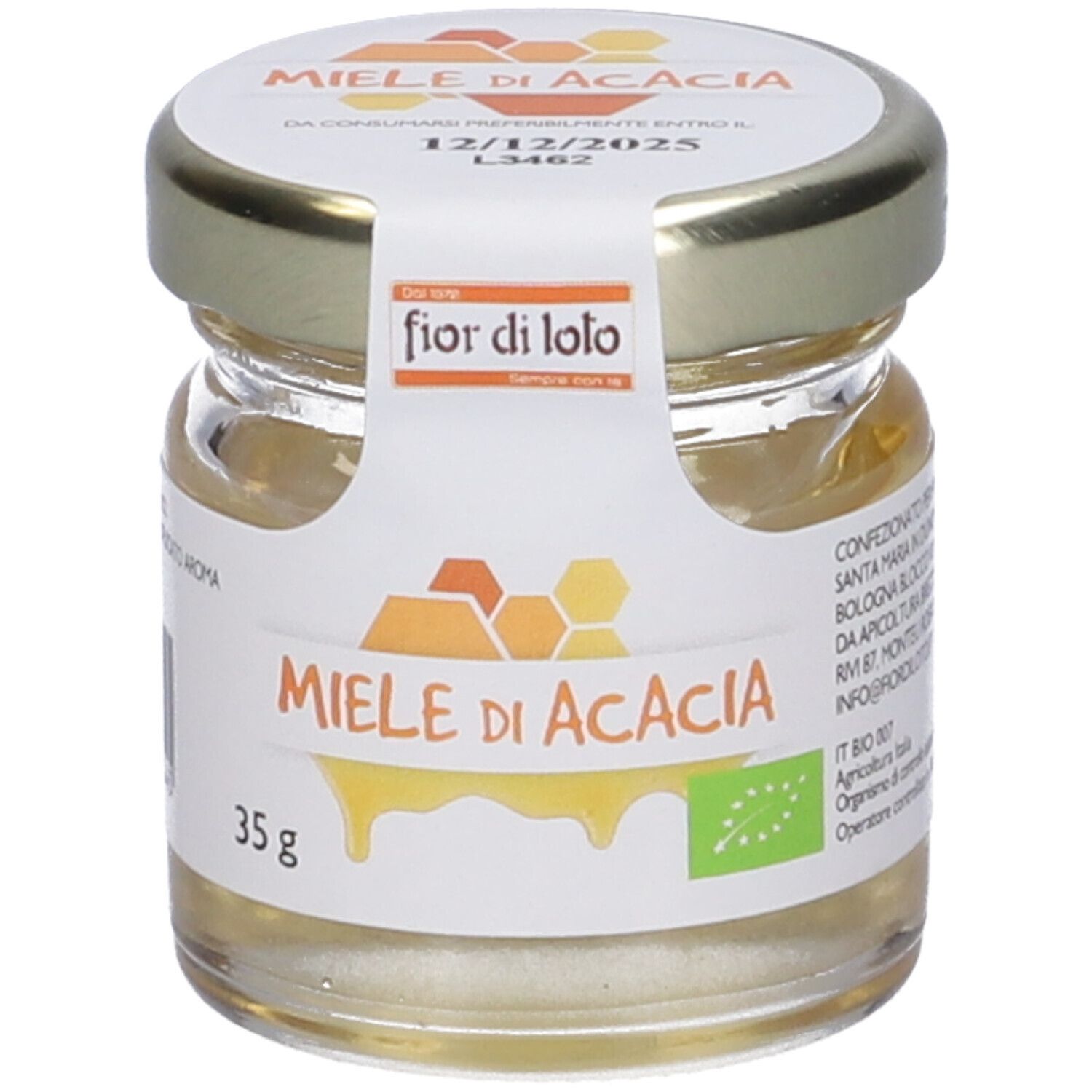Vasetto di miele con etichetta 'Miele di Acacia'. Certificazione biologica. Data di scadenza sul coperchio. Scritta 'fior di loto'.