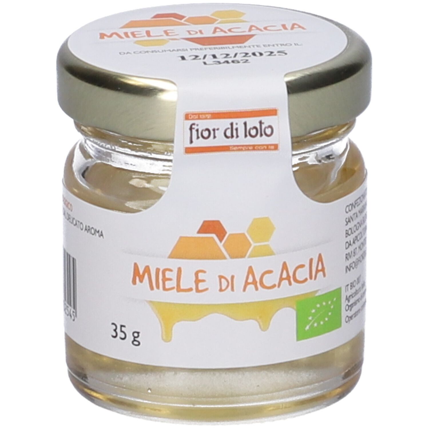 Vasetto di miele con etichetta 'Miele di Acacia'. Certificazione biologica. Data di scadenza sul coperchio. Scritta 'fior di loto'.