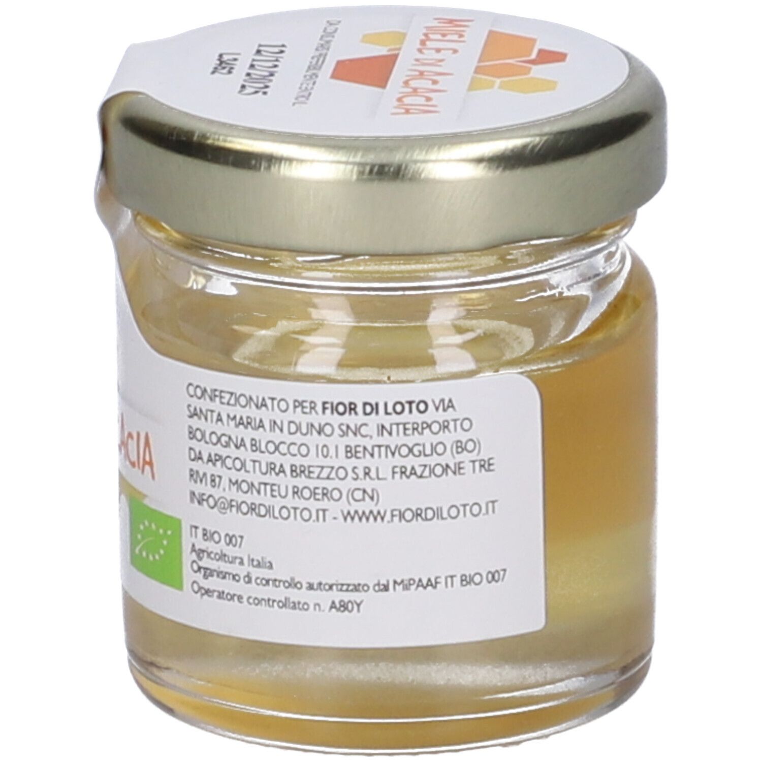 Vasetto di miele con etichetta 'Miele di Acacia'. Certificazione biologica. Data di scadenza sul coperchio. Scritta 'fior di loto'.
