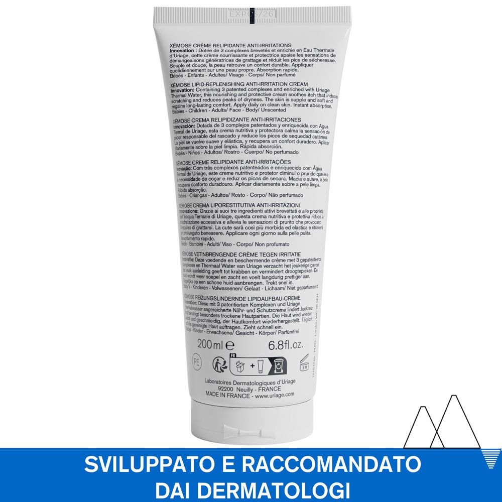 Dos d'un tube blanc. Texte multilingue. Informations sur le produit et ingrédients.