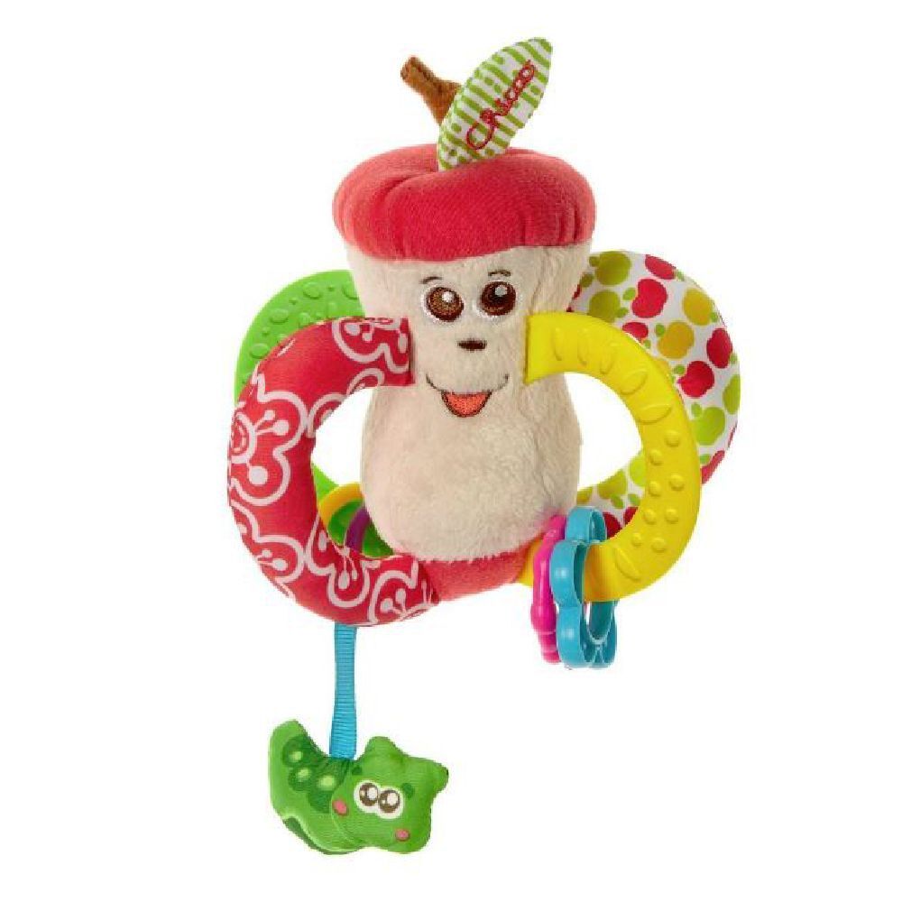 Mela giocattolo con volto, cappello rosso, anelli verdi e ciondolo. Anello giallo con borchie. Marchio Chicco.