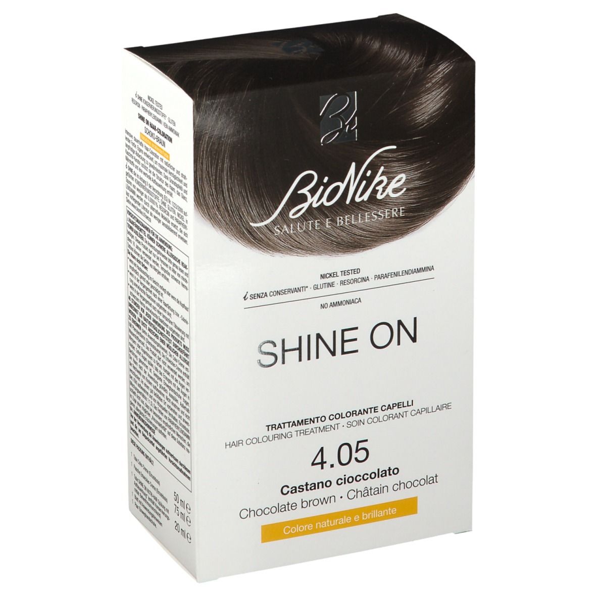 BioNike Shine On colorazione capelli 4.05 Cioccolato marrone. Confezione bianca con nome e tonalità del prodotto. Contiene testo in tedesco, italiano, olandese e francese.