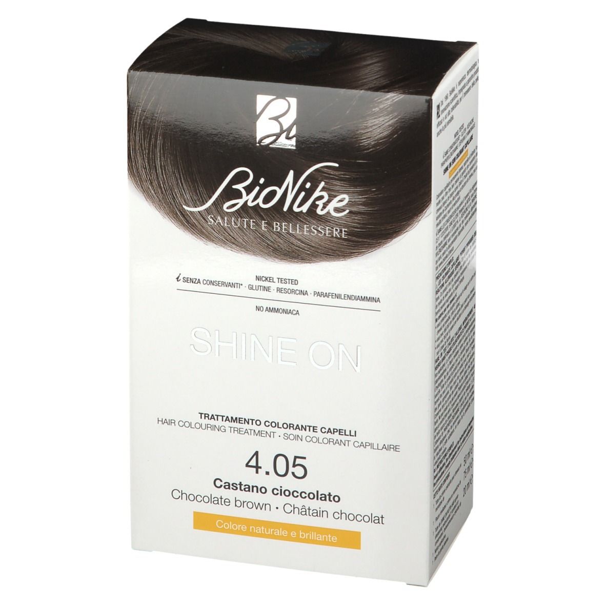 BioNike Shine On colorazione capelli 4.05 Cioccolato marrone. Confezione bianca con nome e tonalità del prodotto. Contiene testo in tedesco, italiano, olandese e francese.