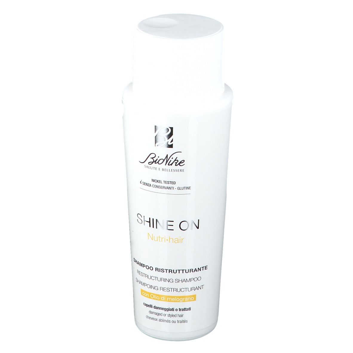 Flacon blanc. Inscription: Shine On Nutri-hair Shampoo. Marque: BioNike. Nickel Tested, sans conservateurs.