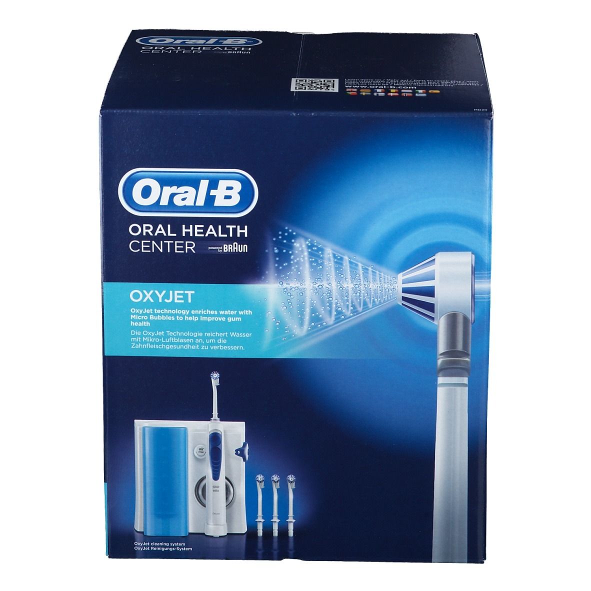 Confezione Oxyjet. Oral-B Oral Health Center. Immagine del prodotto: base, manico, 3 ugelli. Scatola blu con informazioni e illustrazioni.