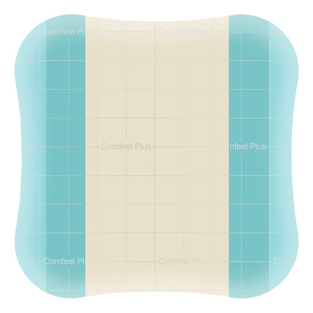 Medicazione con bordi smussati. Forma rettangolare con parte centrale beige chiaro e bordi verde-azzurro. Testo: Comfeel Plus.