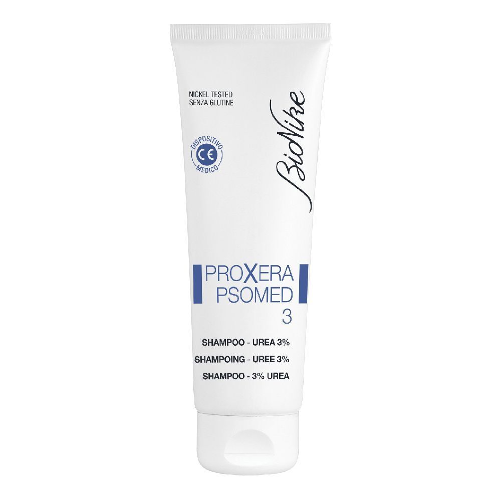 Tubo bianco con banda blu. Scritta: Proxera Psomed 3 Shampoo. Marchio: BioNike. Dispositivo medico.