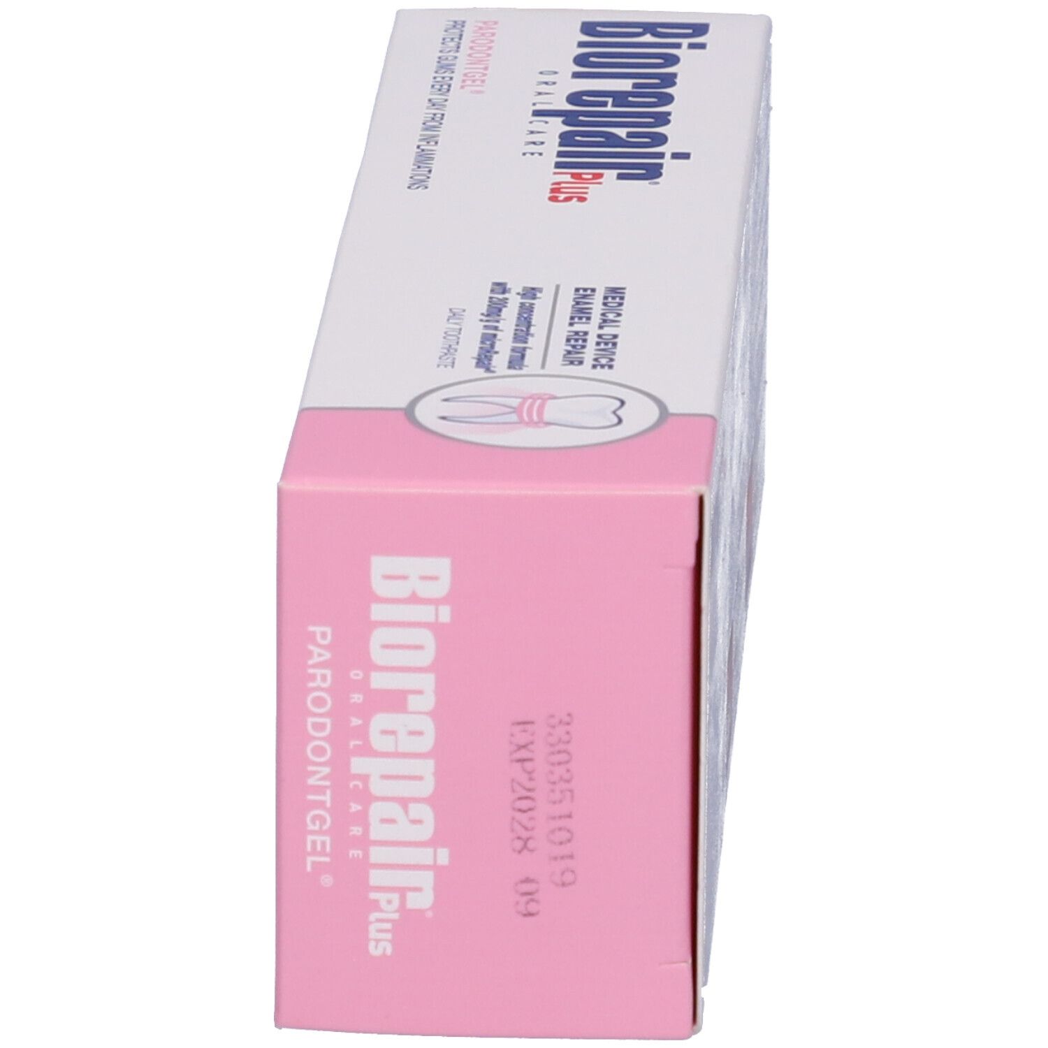 Zahncreme-Verpackung, weiß und rosa. Produktname und medizinische Kennzeichnung. Enthält Informationen und Abbildungen.