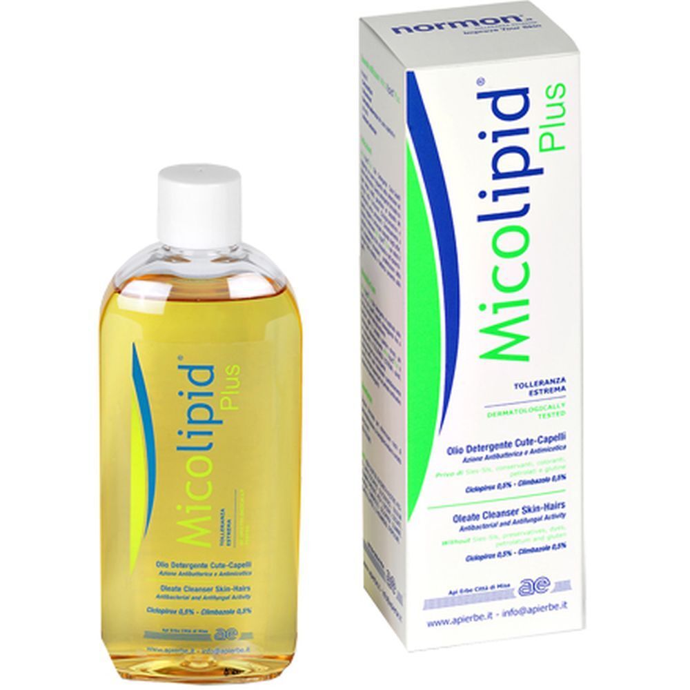Flacone e confezione di Micolipid Plus. Scritta: Olio detergente per cute e capelli. Logo Normon.