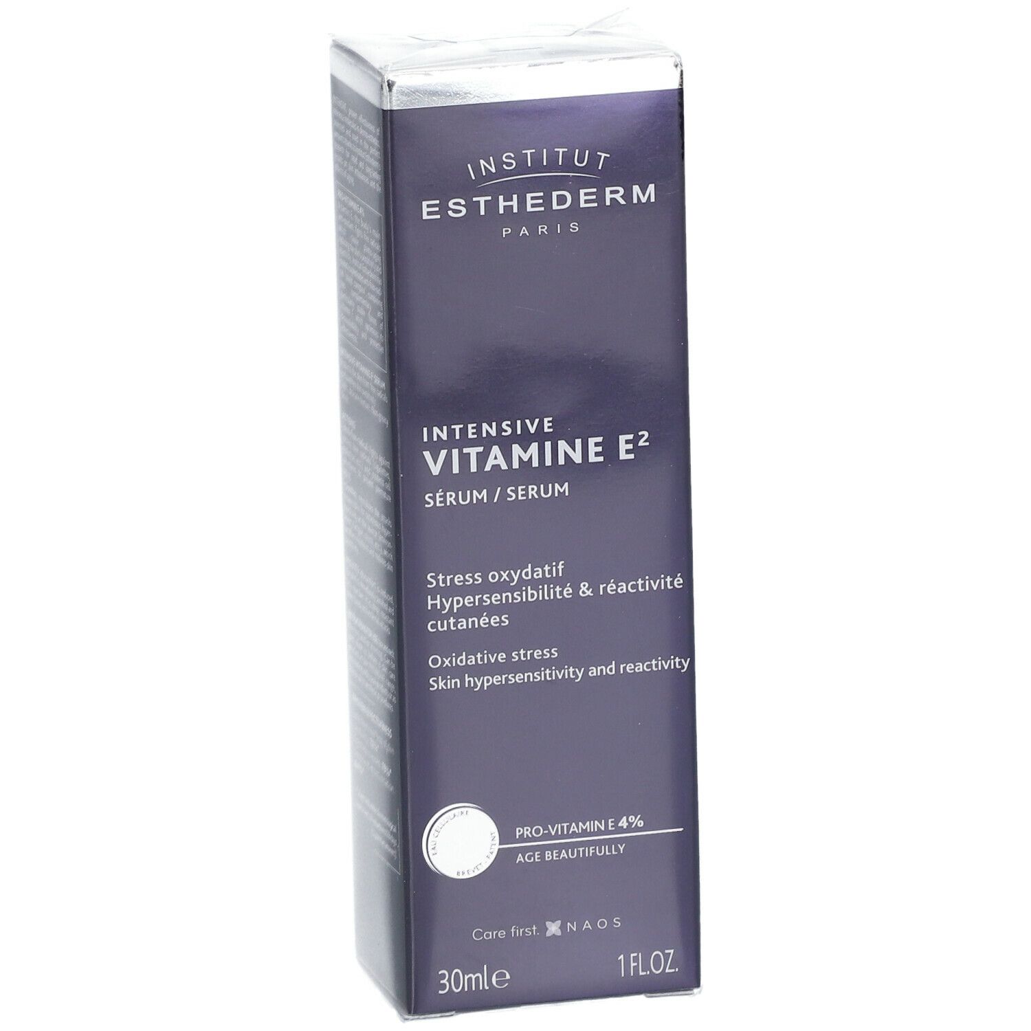 Scatola blu scuro con informazioni sul prodotto. Scritta: INSTITUT ESTHEDERM, INTENSIVE VITAMINE E² SÉRUM. 30ml, 1 FL.OZ.