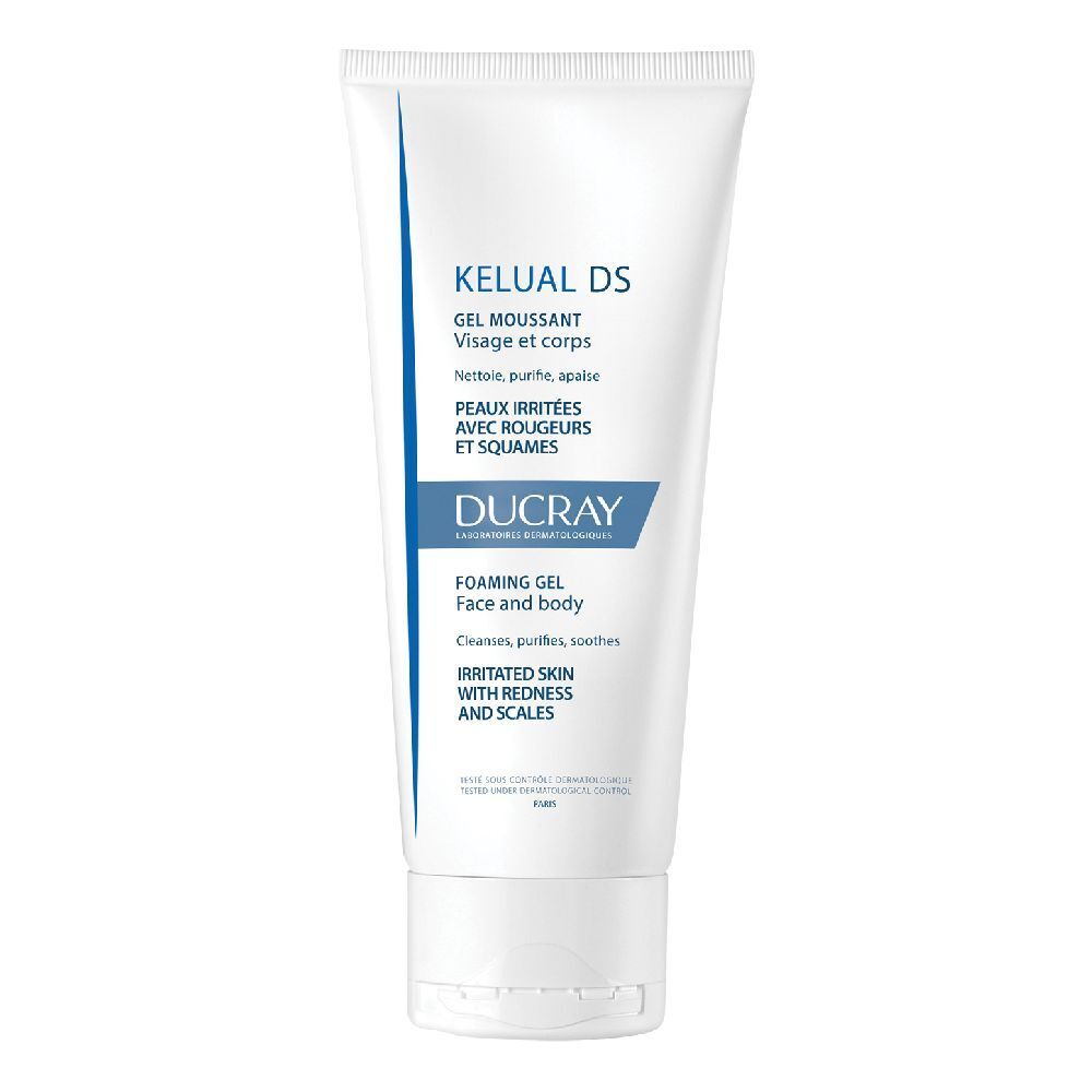 Weißes Tube mit blauem Akzent. Aufschrift: KELUAL DS, Gel moussant, Ducray. Für Gesicht und Körper, bei Hautirritationen mit Rötungen und Schuppen.
