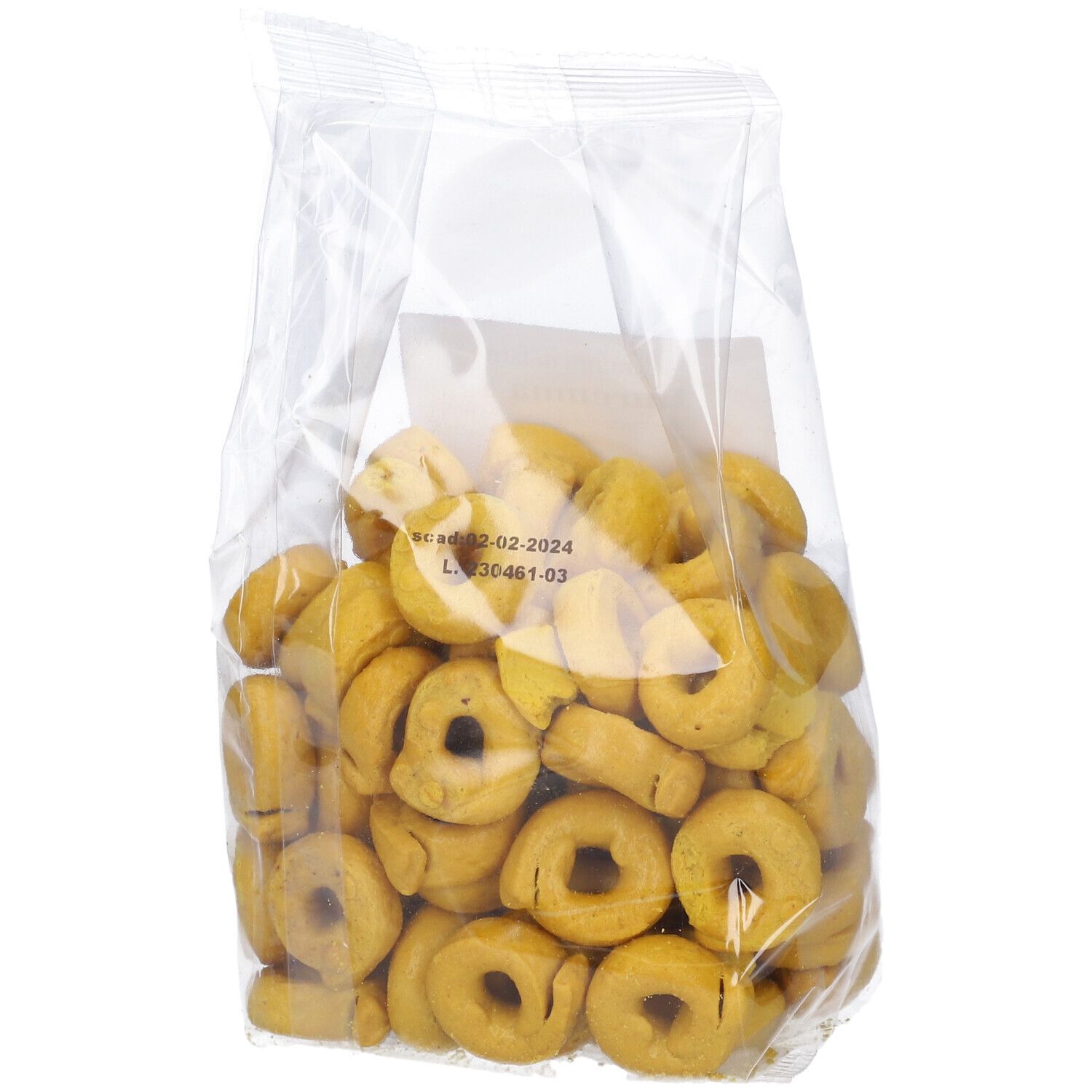 Confezione di tarallini alla curcuma. Confezione trasparente con tarallini gialli a forma di anello. Stampa con informazioni sul prodotto e marchio bio.