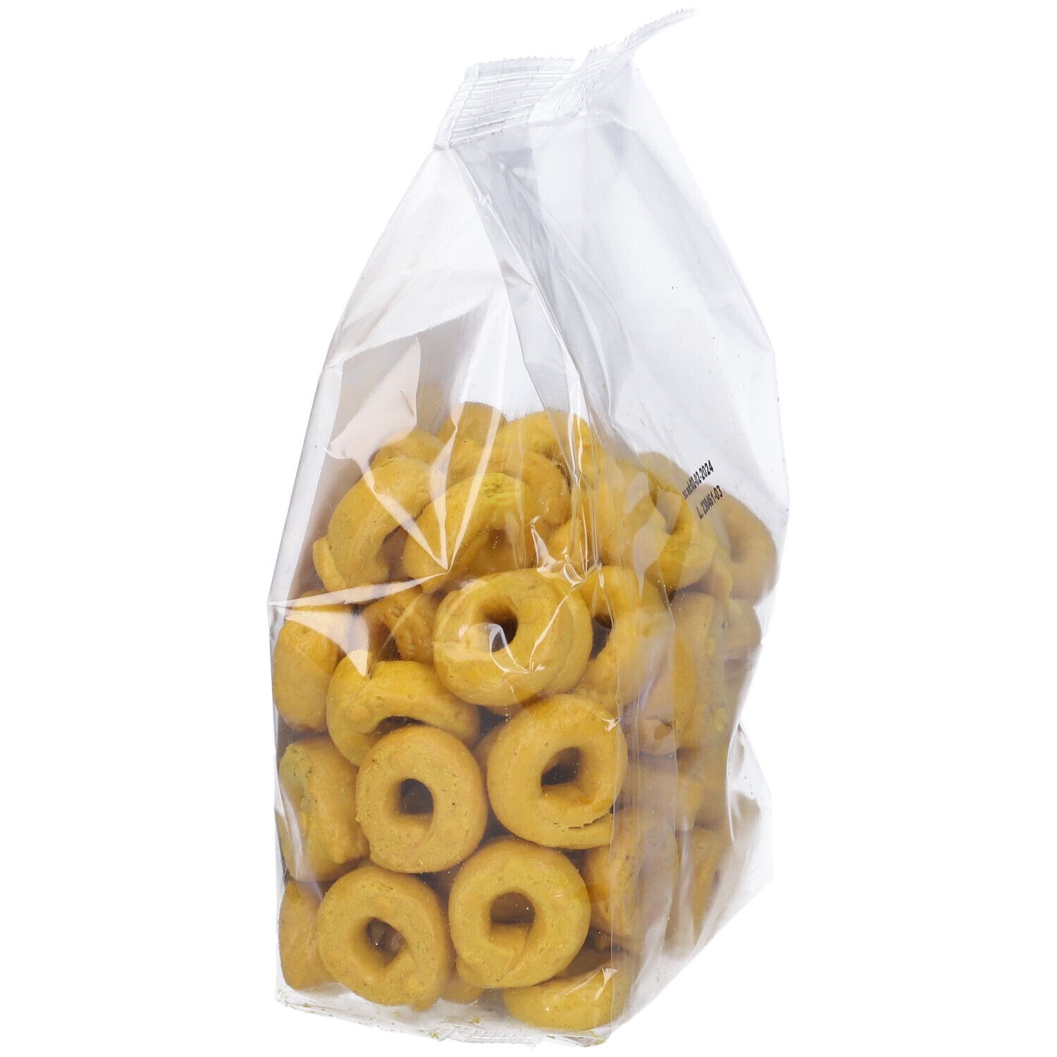 Confezione di tarallini alla curcuma. Confezione trasparente con tarallini gialli a forma di anello. Stampa con informazioni sul prodotto e marchio bio.