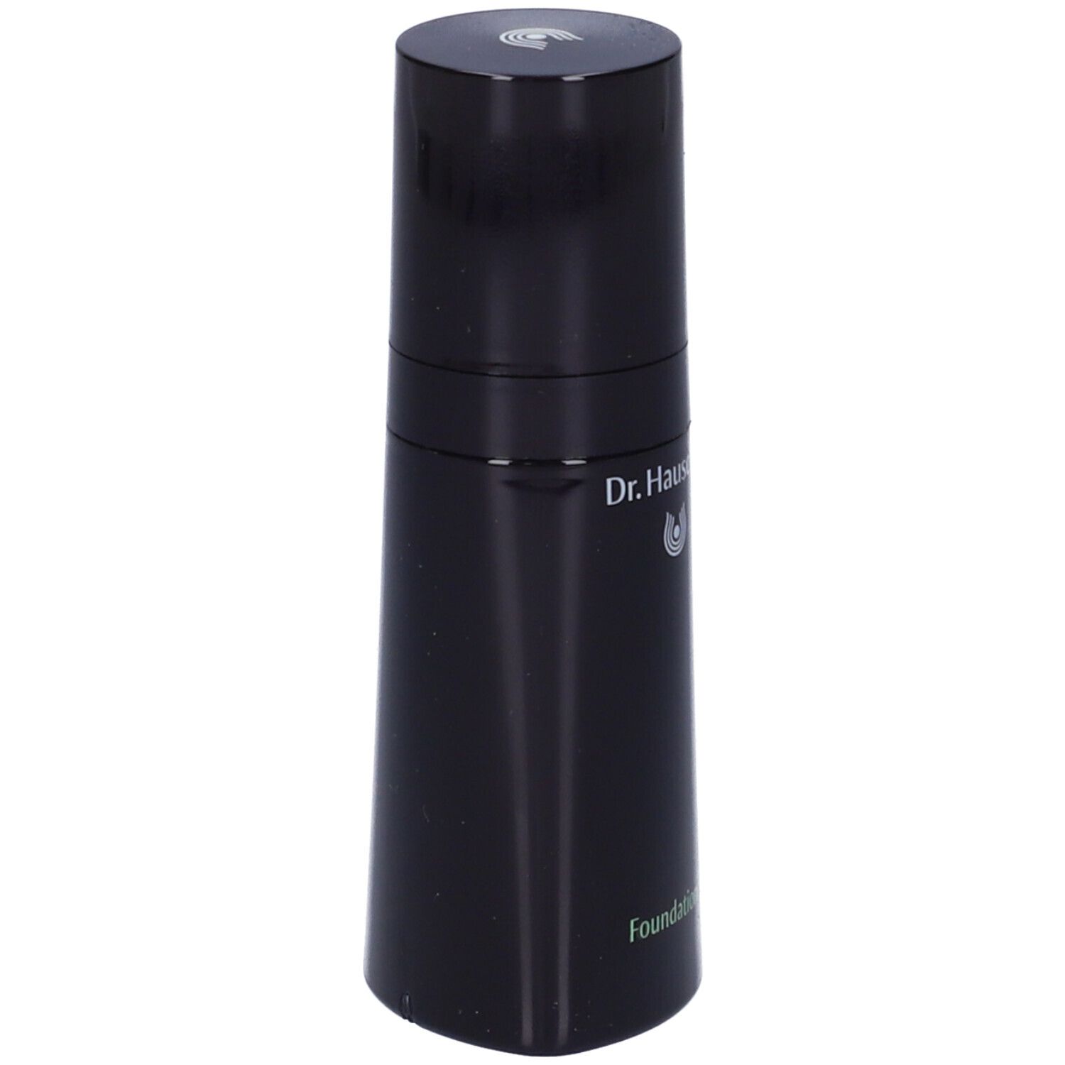 Flacone nero con tappo rotondo. Scritta: Dr. Hauschka. Prodotto: Foundation.