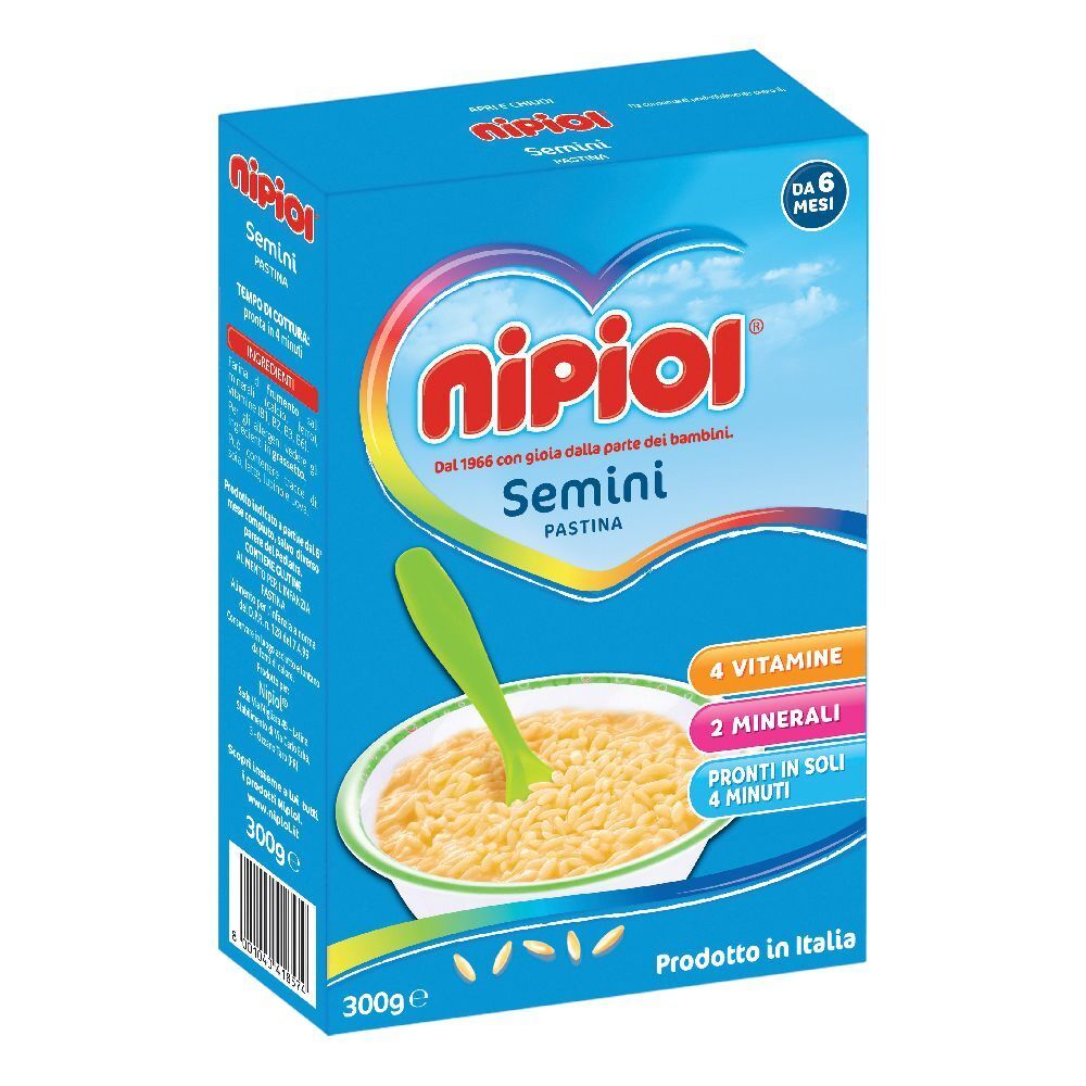 Confezione blu con immagine del prodotto. Contiene Pastina Semini. Scritte: Nipiol, Semini, 4 vitamine, 2 minerali, 300g.