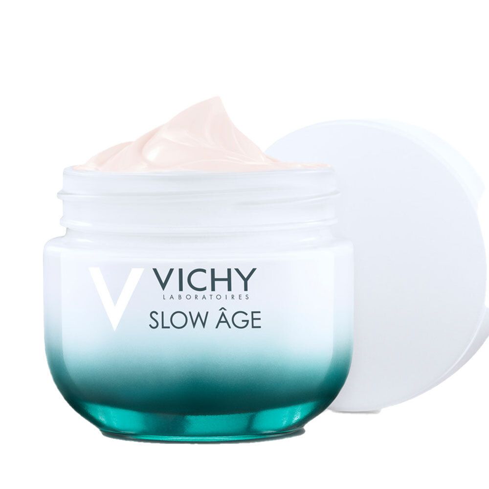 Vaso di crema aperto con coperchio bianco. Crema con tonalità rosa visibile. Scritta: VICHY SLOW ÂGE.