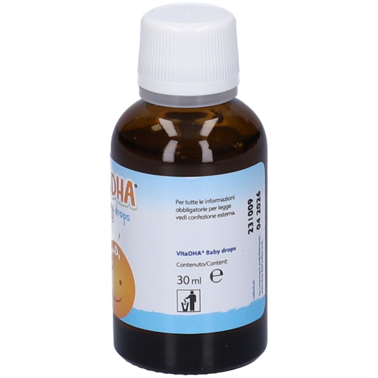 Flacone di vetro marrone con tappo bianco. Etichetta con VitaDHA Baby Drops, Omega-3 DHA, vitamina D3 ed E. Scritta: « 30 ml » e bidone.