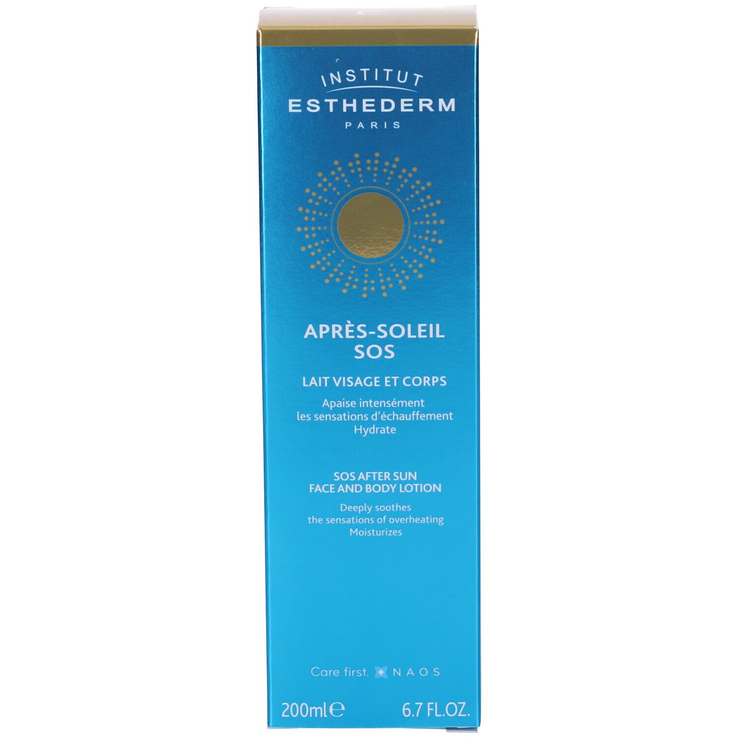 Scatola blu. Scritta: Après-soleil SOS, Lait Visage et Corps. Marchio: Institut Esthederm Paris. Cerchio dorato.