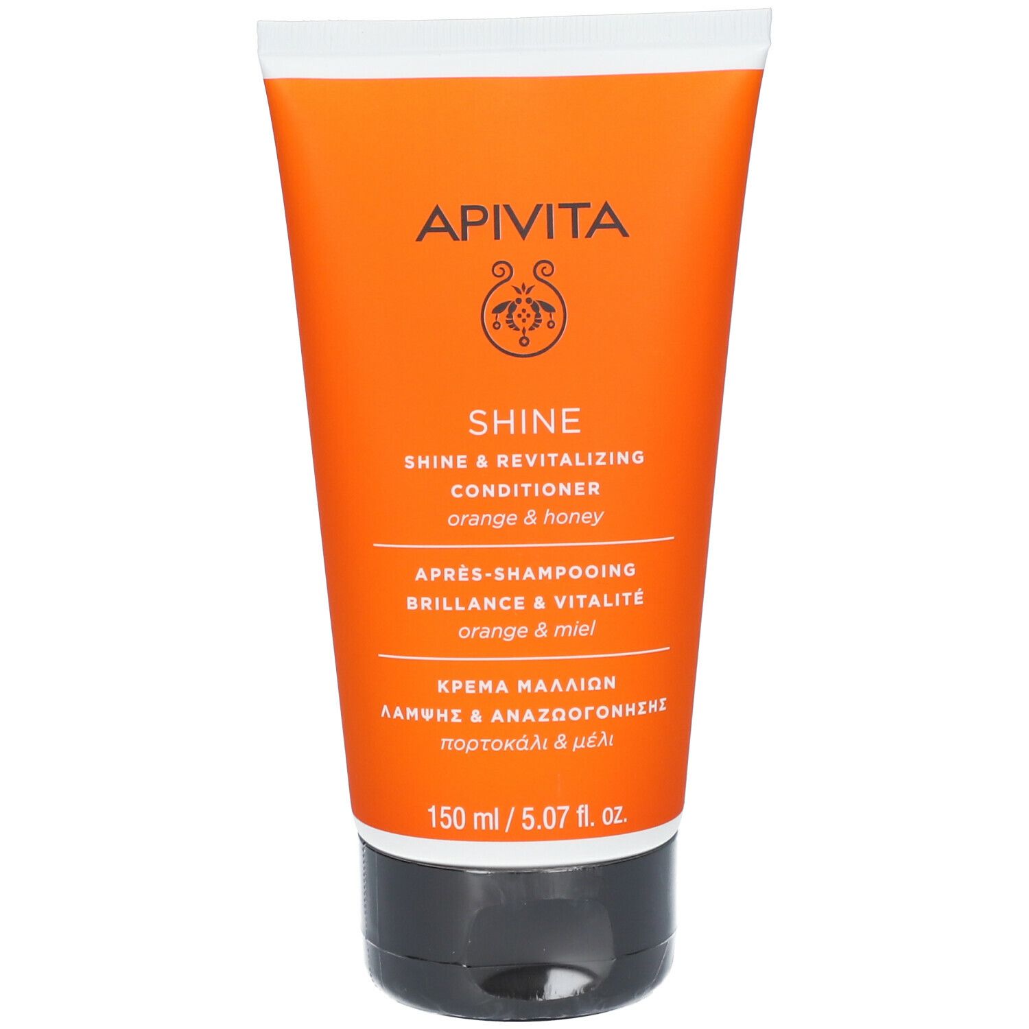 Tube orange avec bouchon blanc. Inscription: APIVITA SHINE Conditioner. Texte multilingue.