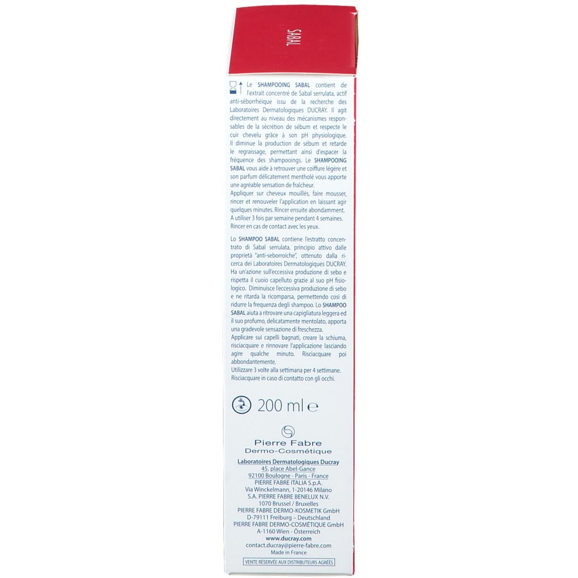 Lato di una scatola bianca con coperchio rosso. Testo in francese. Scritte: Sabal, Ducray, 200 ml.