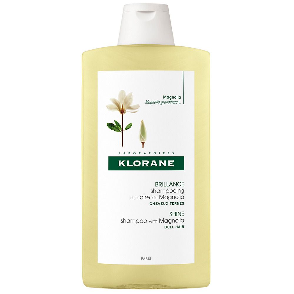 Gelbliche Shampoo-Flasche mit weißem Deckel. Aufdruck: KLORANE, Magnolia-Blüte, "Brillance shampooing", "Shine shampoo with Magnolia".