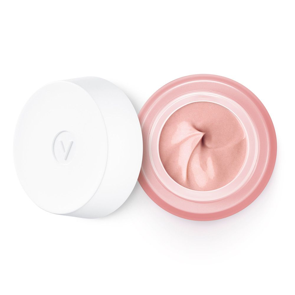 Vasetto di crema rosa aperto con coperchio bianco. Crema rosa all'interno. Logo 'V' sul coperchio.