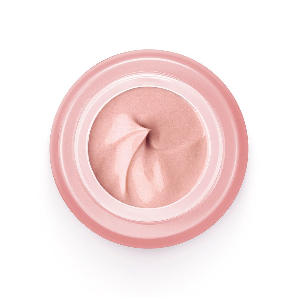 Vista dall'alto di un vasetto di crema rosa con crema rosa. Nessuna scritta visibile.