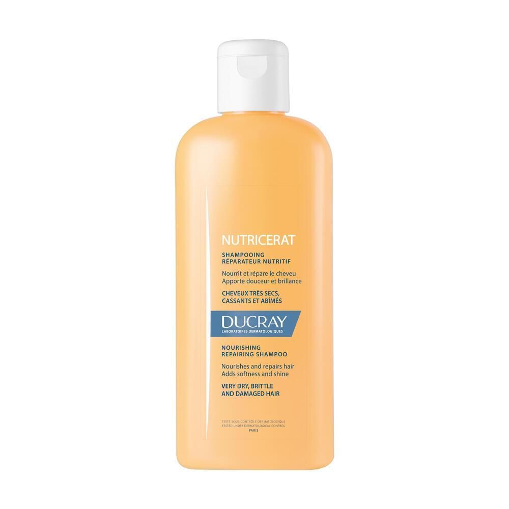 Flacon jaune avec bouchon blanc. Inscription: DUCRAY Nutricerat Shampoo, pour cheveux très secs et abîmés.