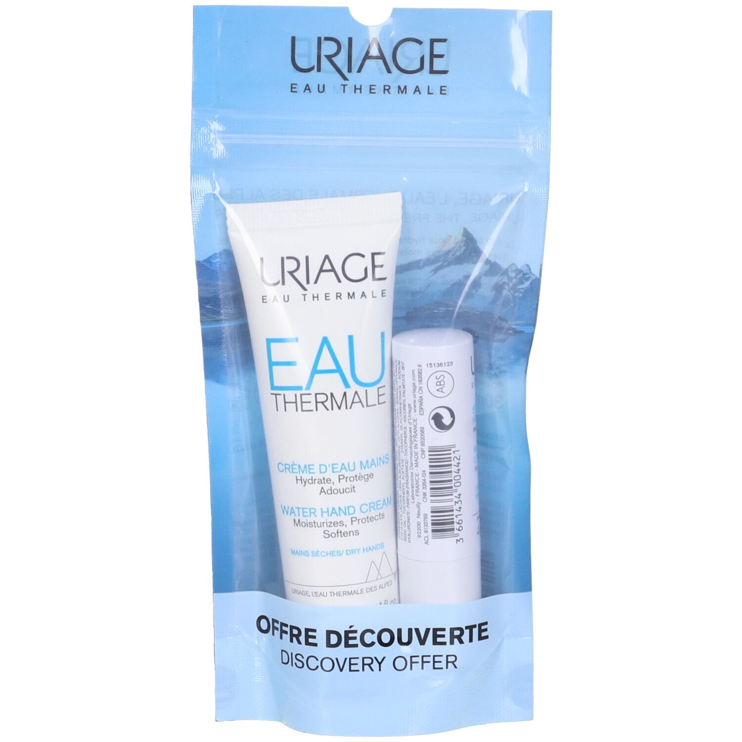 Set Uriage Eau Thermale. Crema mani e stick labbra in confezione trasparente. Visibile: nome del marchio, nomi dei prodotti e "Discovery Offer".