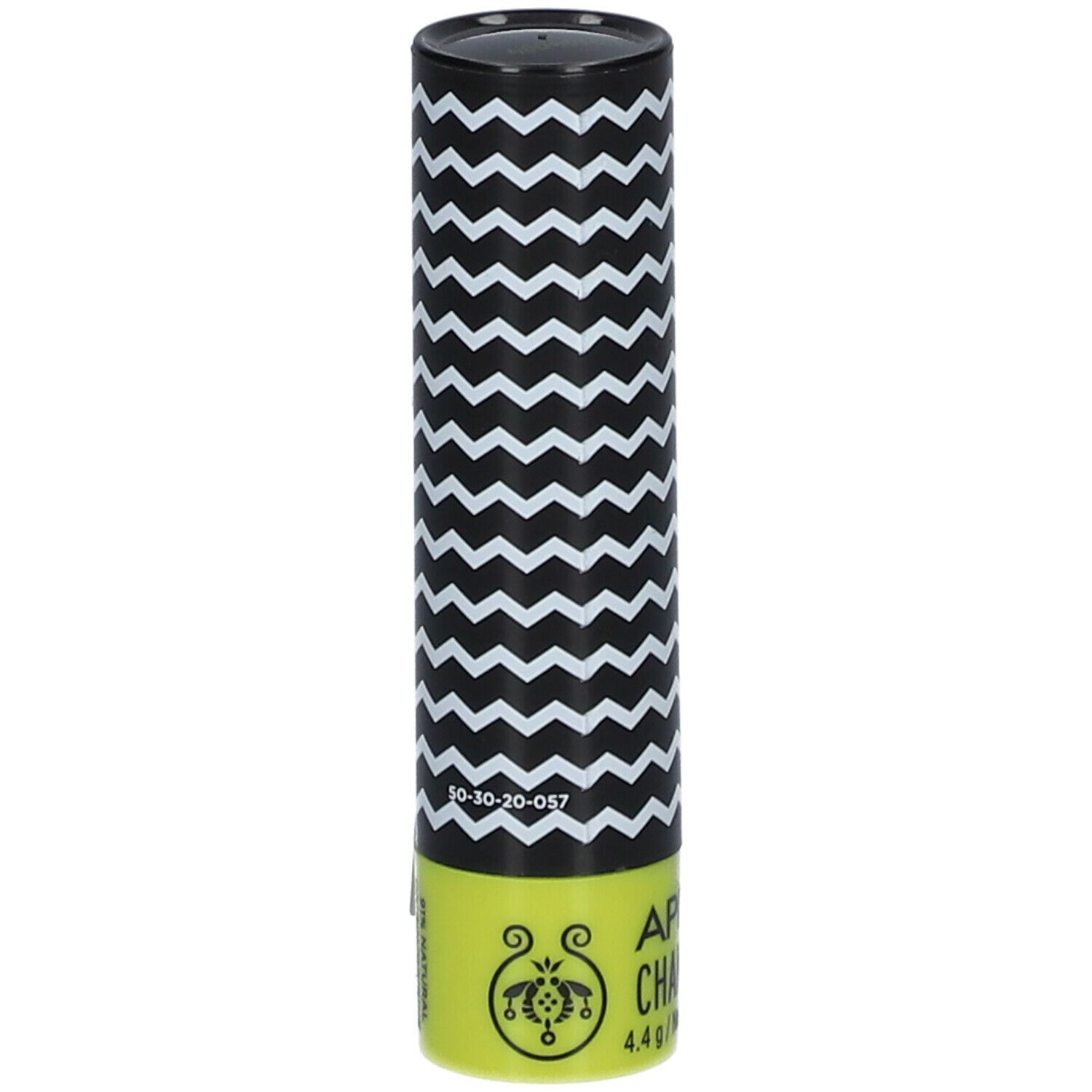 Confezione cilindrica con motivo a zig-zag bianco e nero. Scritta: APIVITA CHAMOMILE, 4.4 g. Base gialla con logo.