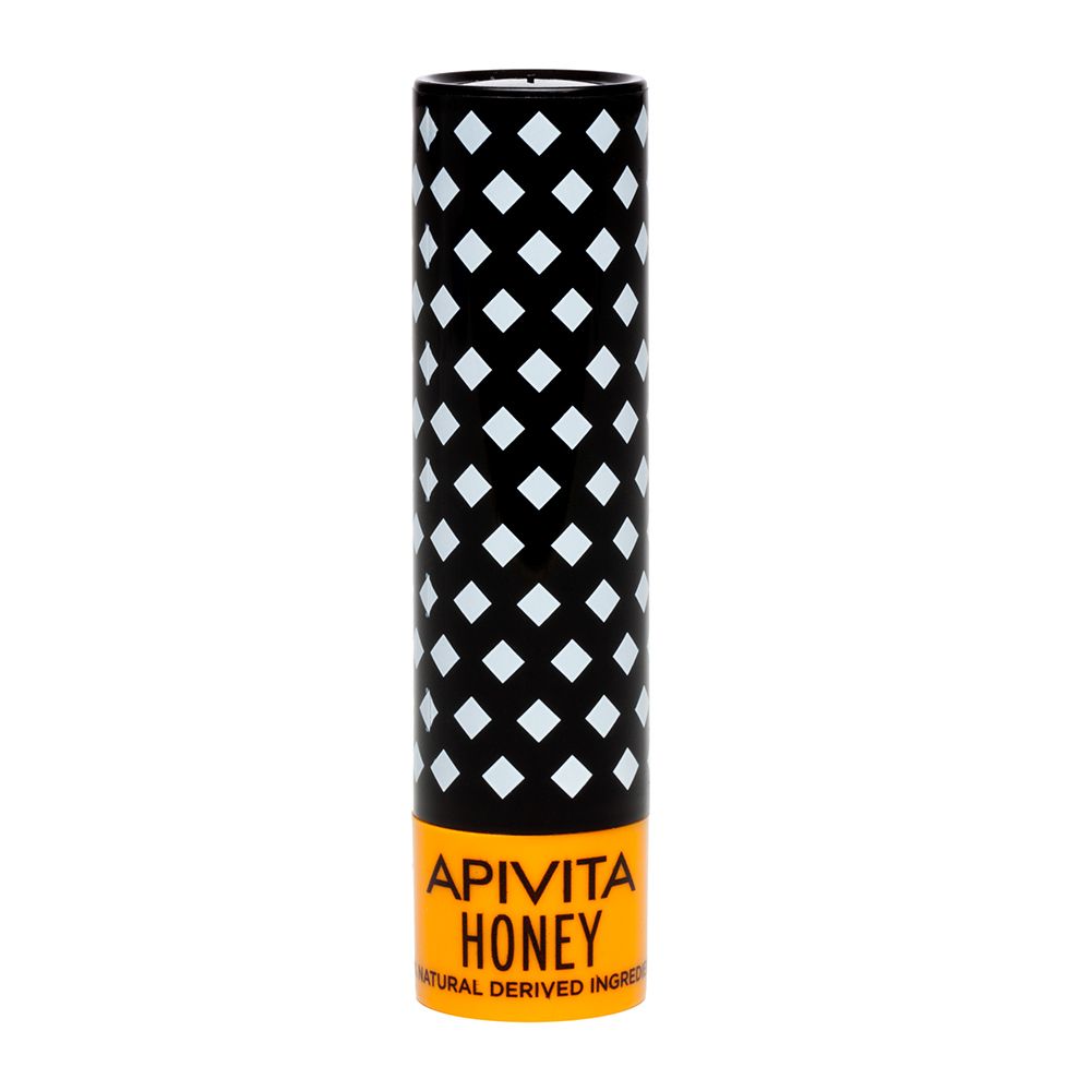 Stick balsamo labbra. Cilindrico, nero con motivo a rombi bianchi. Base arancione con "APIVITA HONEY".