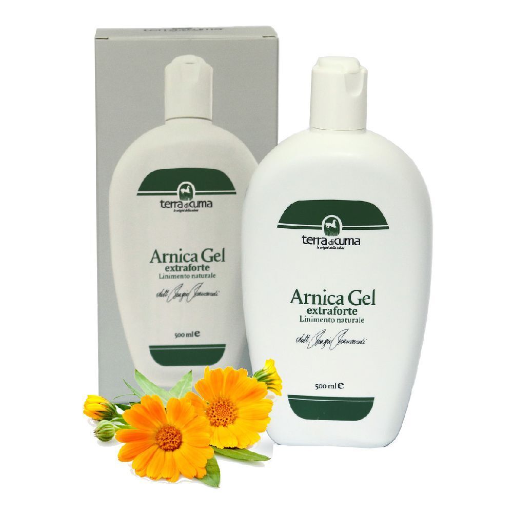 Weiße Flasche mit grünem Etikett und Produktnamen. Daneben eine Schachtel und Blüten.