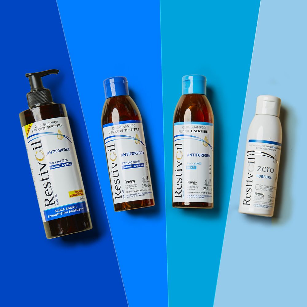 Quattro flaconi di shampoo Restivoil. Design diversi. Sfondo blu e bianco. 250ml.