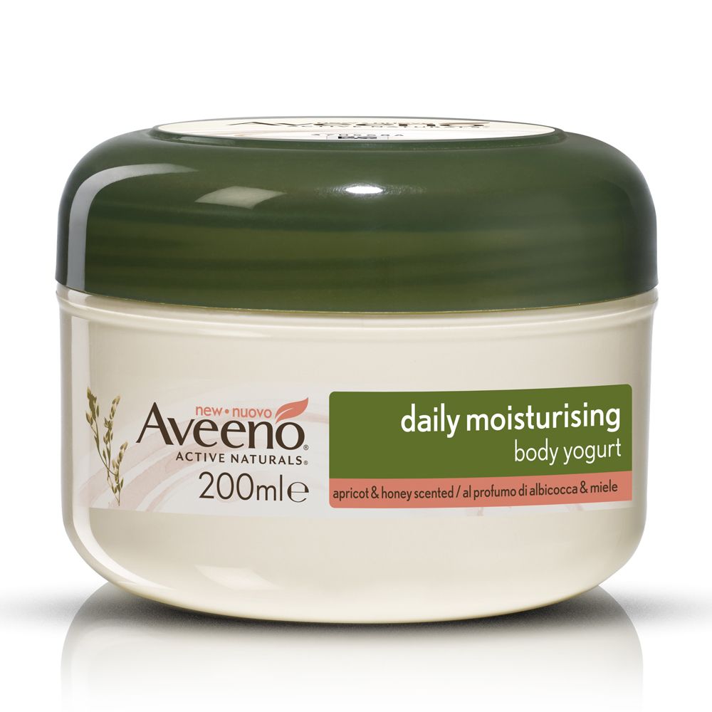 Vaso di crema con coperchio verde. Scritta Aveeno, Daily Moisturising, 200ml. Etichetta con testo: apricot & honey scented.