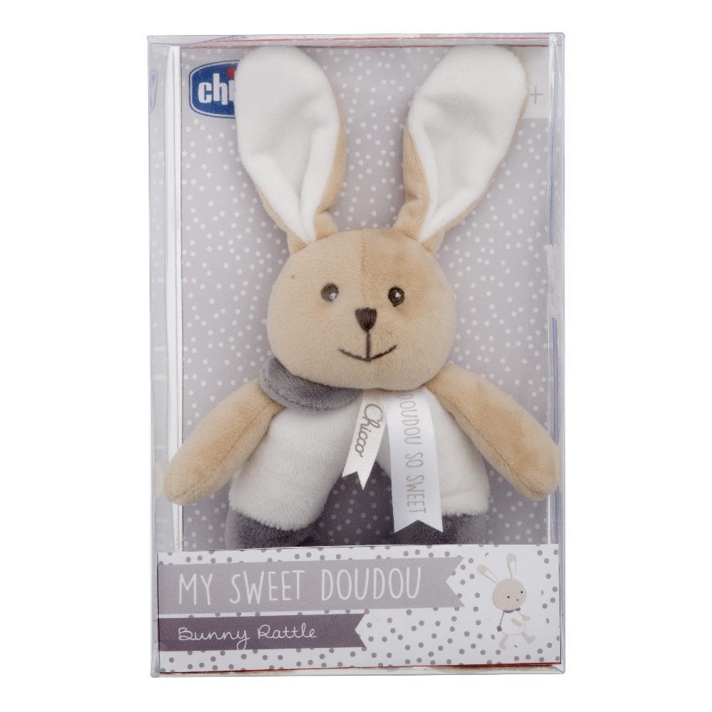 Sonaglio Chicco a forma di coniglio, confezionato. Beige, grigio e bianco. Con nastro e scritta.