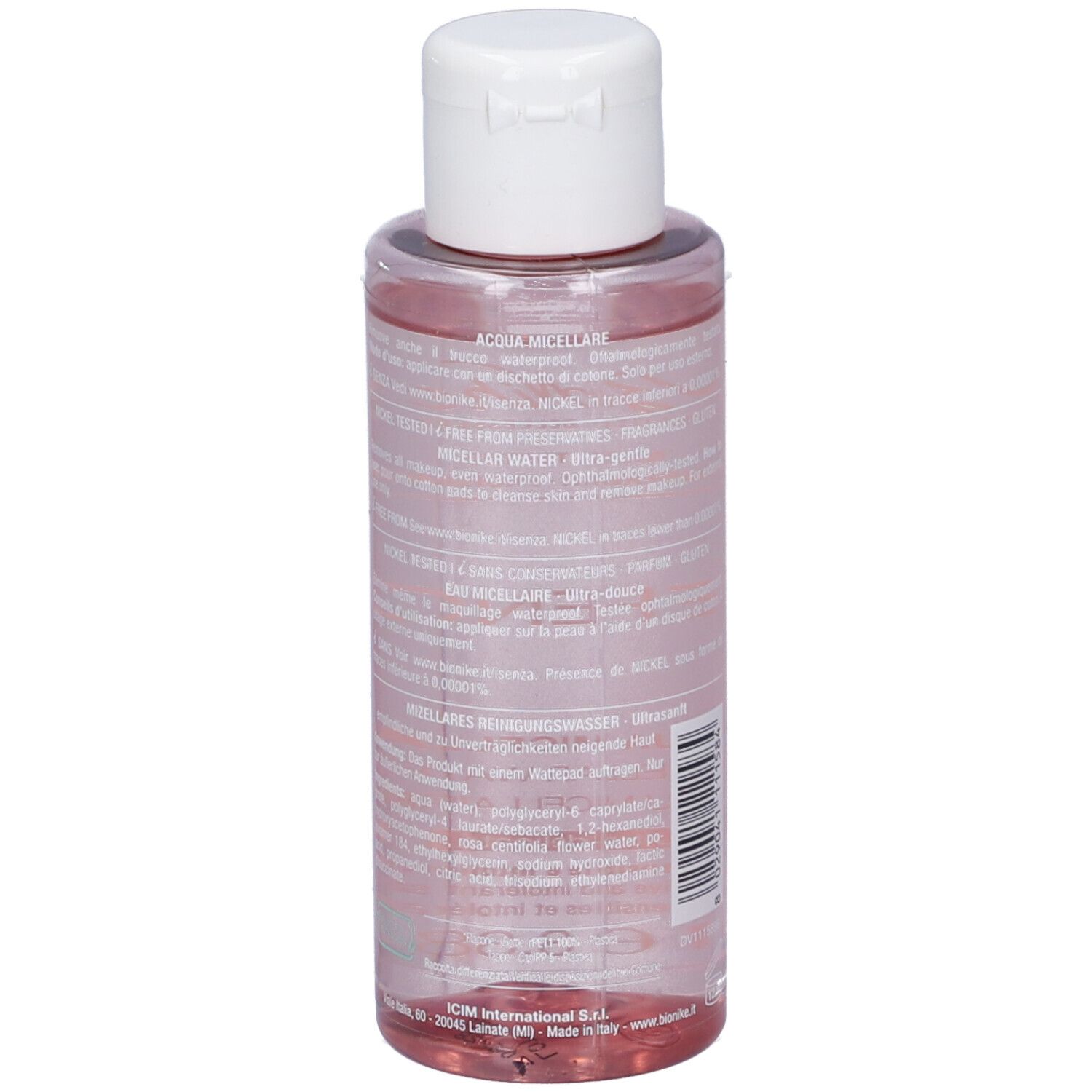Klare Flasche mit weißem Klappdeckel, gefüllt mit rosafarbener Mizellenwasser-Flüssigkeit. Etikett mit Produktinformationen.