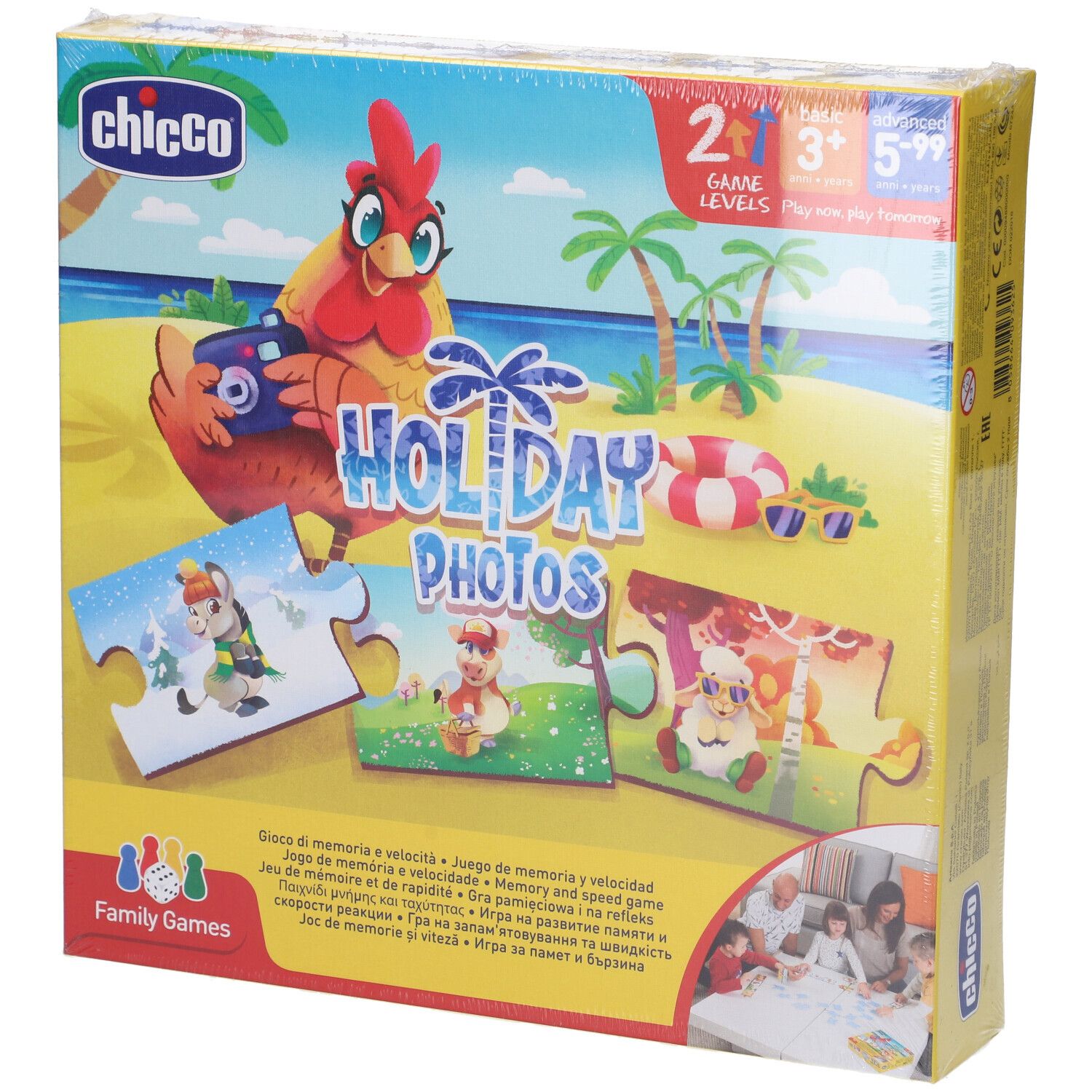 Scatola del gioco "Holiday Photos" confezionata. Sulla scatola sono raffigurati pezzi di puzzle con motivi di animali, una gallina ed elementi spiaggia.