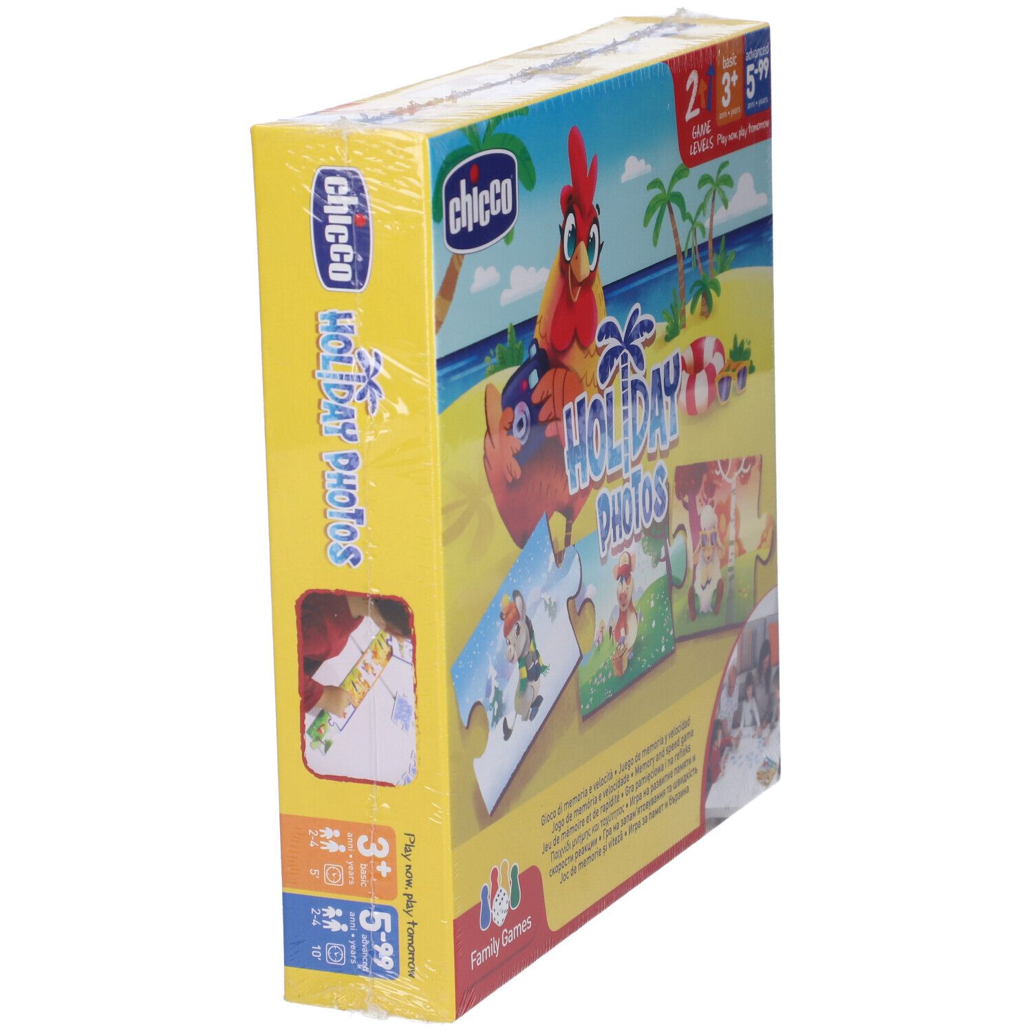 Scatola del gioco "Holiday Photos" confezionata in pellicola. Sulla scatola sono raffigurati pezzi di puzzle con motivi di animali, una gallina ed elementi spiaggia.