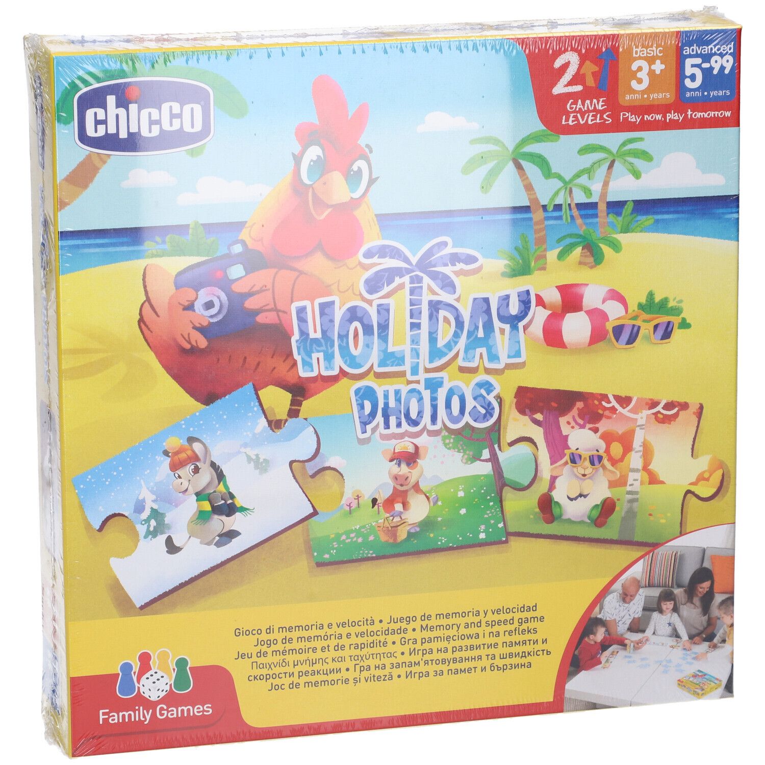 Scatola del gioco "Holiday Photos" confezionata in pellicola. Sono raffigurati pezzi di puzzle con motivi di animali, una gallina ed elementi spiaggia.