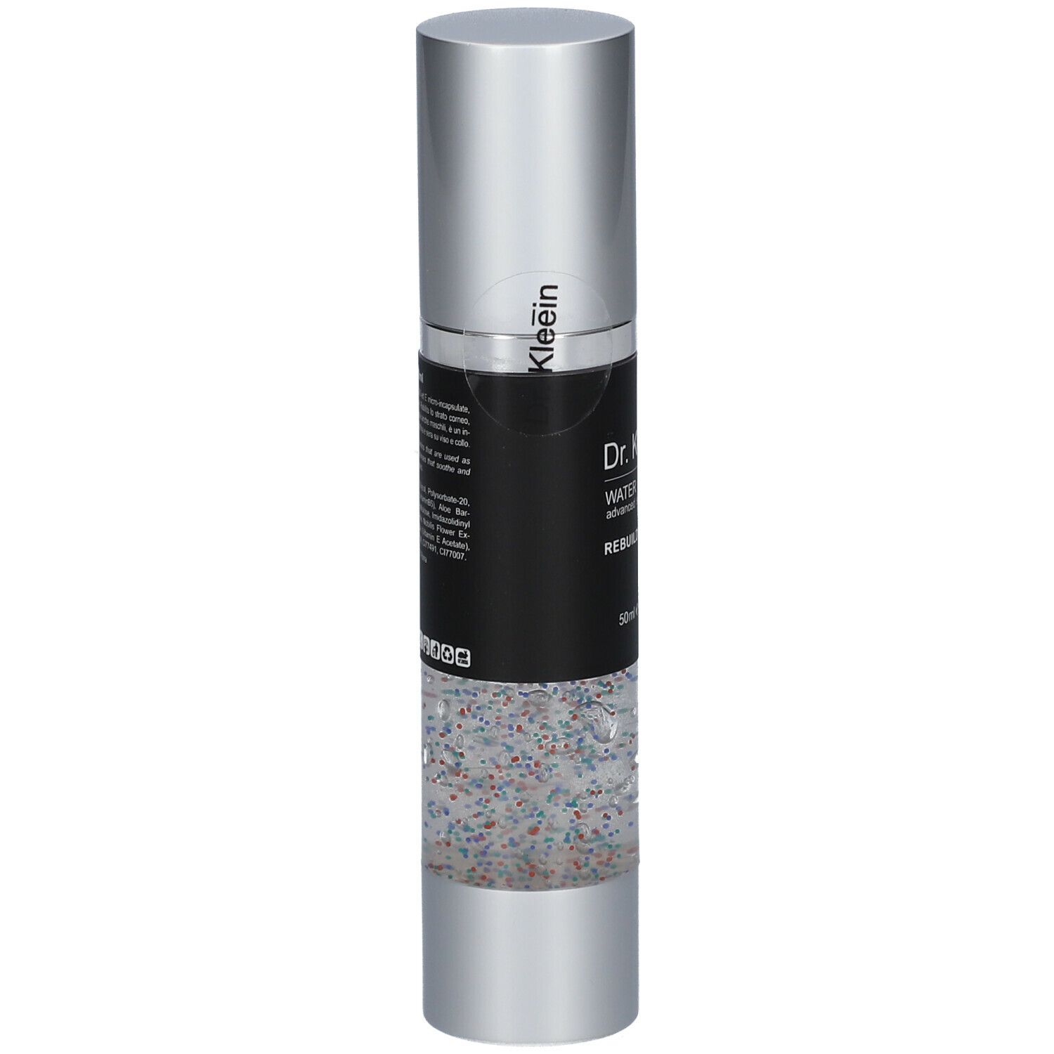 Flacone cilindrico con tappo argentato. Etichetta nera con nome e testo del prodotto. Parte inferiore trasparente con particelle colorate.