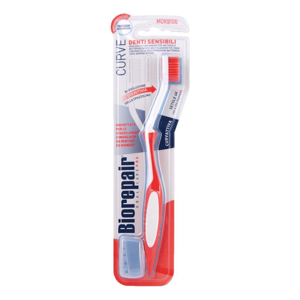 Zahnbürste in Verpackung. Roter Griff, weißer Bürstenkopf mit roten Borsten. Sichtbare Marke: Biorepair.